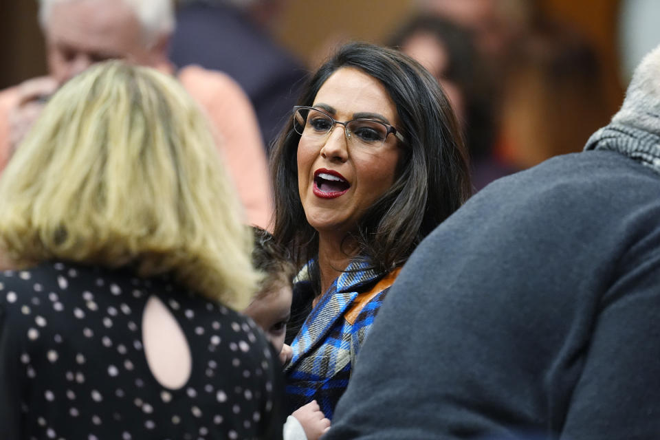 FILE - Rep. Lauren Boebert, R-Colo., greets attendees at the first Republican primary debate for the 4th Congressional district seat, Jan. 25, 2024, in Fort Lupton, Colo. Boebert left her competitive 3rd District race to compete instead in the safer 4th district for the Tuesday, June 25, state primary. Since her election in 2020, Boebert has become a polarizing figure for her combative style and penchant for controversy, but likely improved her chances at reelection with the move to a district that former President Donald Trump carried twice. (AP Photo/David Zalubowski, File)