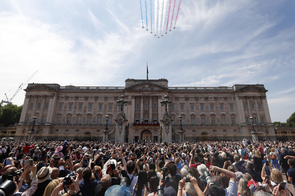 FILE - In this Saturday, June 9, 2018 file photo, Red Arrows fly over Buckingham Palace to attend the annual Trooping the Colour Ceremony in London. Buckingham Palace says the monarchy cost the taxpayer 67 million pounds ($85.2 million) during 2018-19, a 41% increase on the previous financial year. Expenditures rose primarily because of higher levels of spending devoted to critical renovation and repair for Buckingham Palace. (AP Photo/Frank Augstein, File)