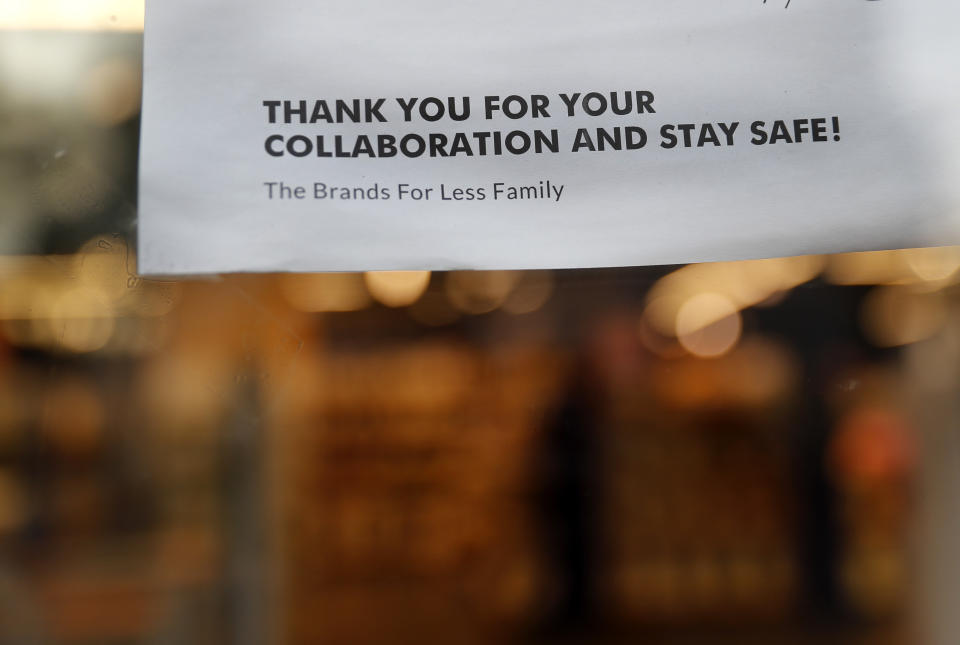 A sign is posted at the entrance of an international fashion and homeware retailer that will temporarily shut down from Friday in the face of an increasingly volatile currency market and their inability to set prices while the Lebanese pound plunges against the dollar, in Beirut, Lebanon, Thursday July 2, 2020. Later in the day, owners of the businesses rallied in central Beirut to denounce the government's inability to handle a deepening economic and financial crisis, and urging others to join them after the Lebanese pound recorded a new low Thursday, selling at nearly 10,000 for a dollar and maintaining the downward slide that saw the national currency lose about 85% of its value over the past months. (AP Photo/Hussein Malla)