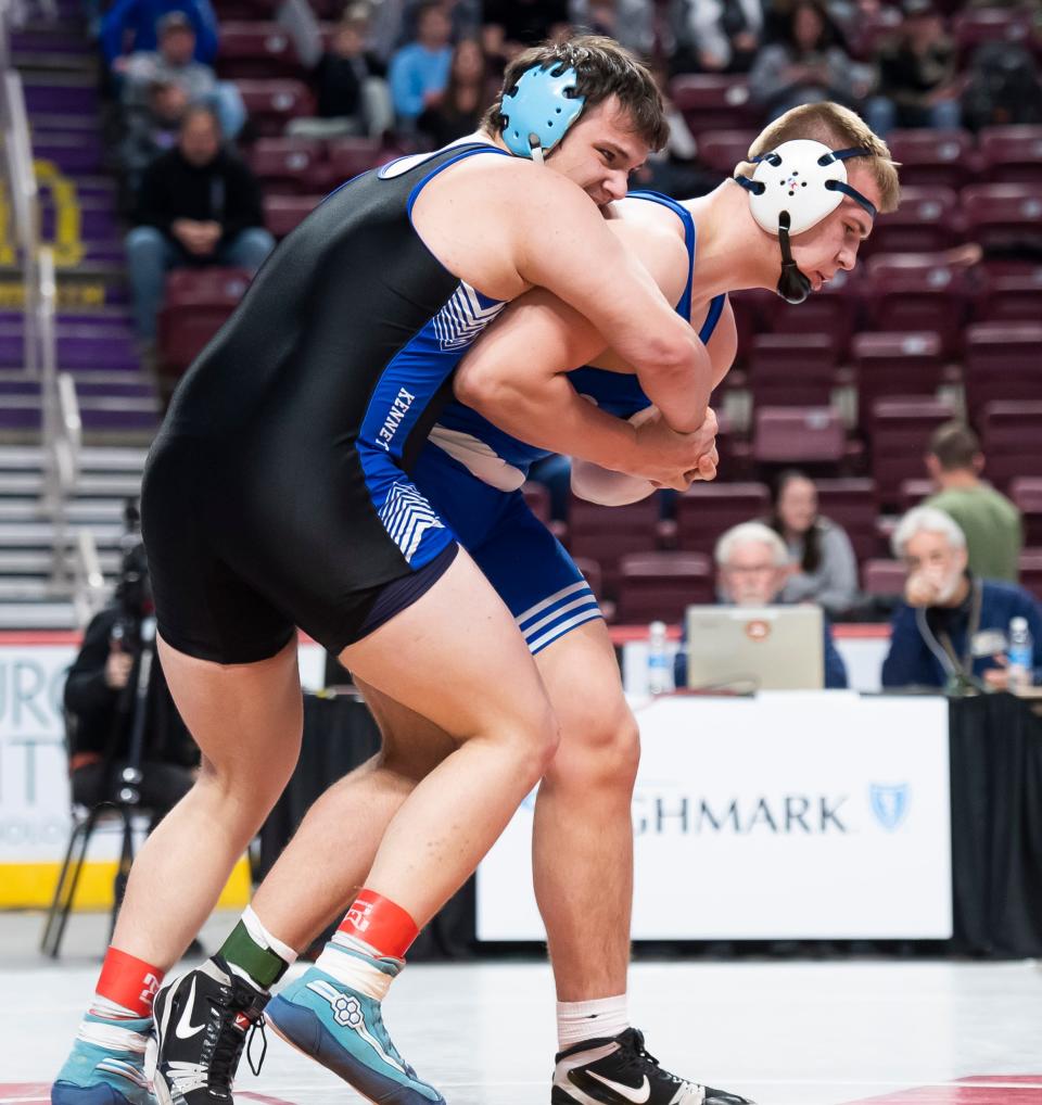 Spring Grove's Michael Hershey (right) tries to escape Kennett's Bailey Shindle in the 285-pound seventh-place bout at the PIAA Class 3A Wrestling Championships at the Giant Center on March 11, 2023, in Hershey. Hershey was leading 4-2 before winning by default.