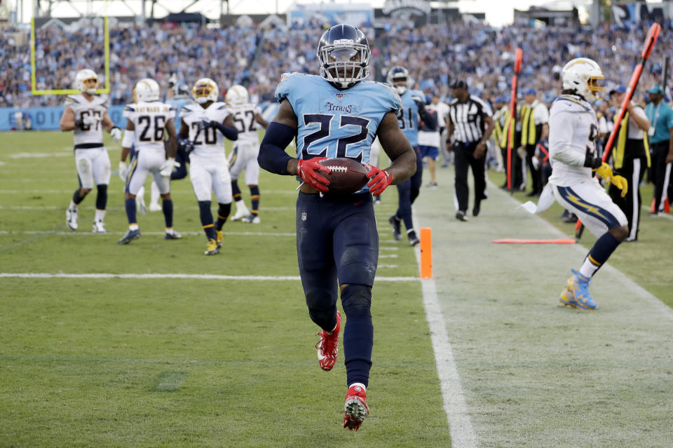 Tennessee Titans running back Derrick Henry (22) scores a touchdown on an 11-yard run against the Los Angeles Chargers in the second half of an NFL football game Sunday, Oct. 20, 2019, in Nashville, Tenn. (AP Photo/James Kenney)