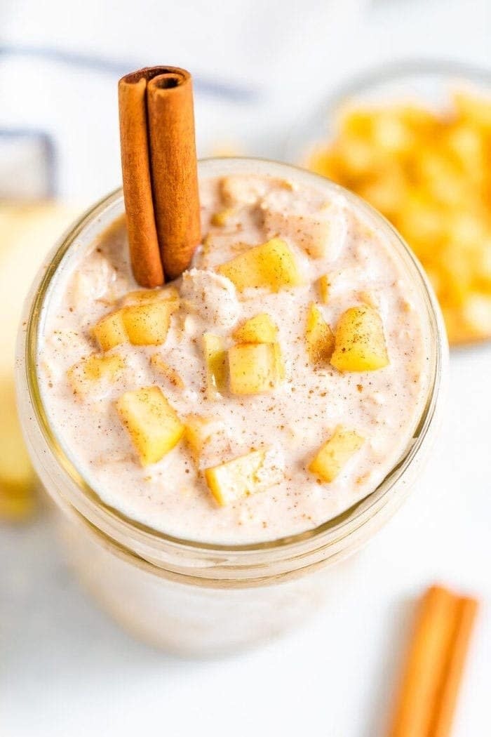 Apple Pie Overnight Oats in a bowl with cinnamon sticks