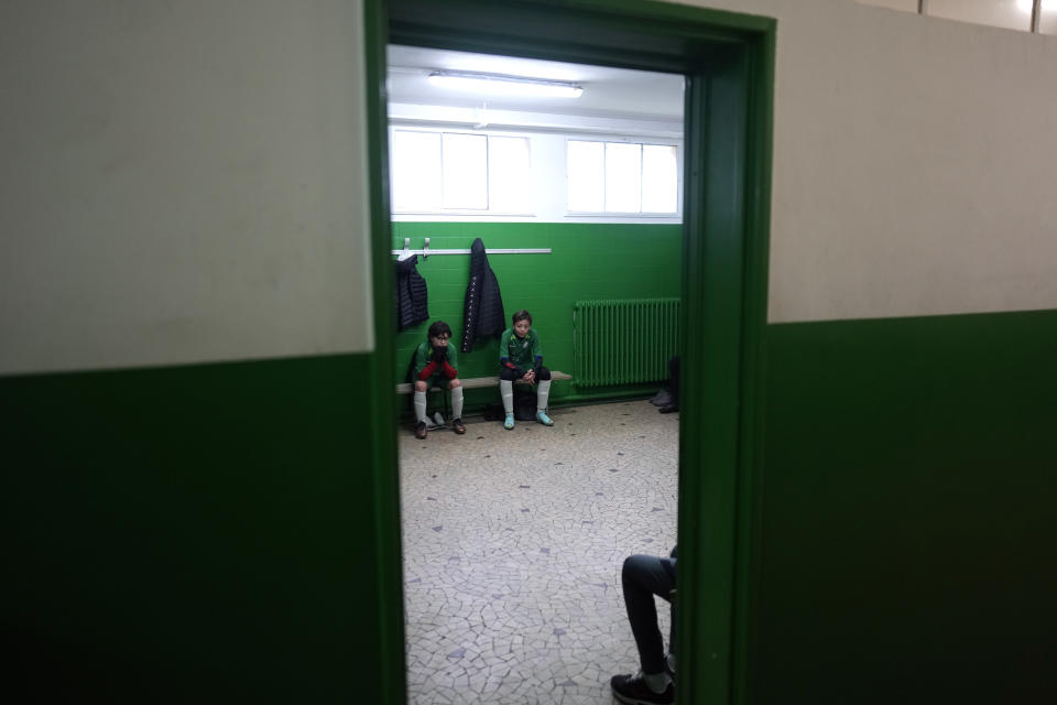 Players of the football club AS Bondy, where Kylian Mbappe played as a kid, during half time in the Leo Lagrange stadium in Bondy, east of Paris, Saturday, Dec. 17, 2022. On the football fields where Kylian Mbappe hones the feints, dribbles and shots that all of France hopes to see in Sunday's World Cup final against Argentine, the next generation of French kids with big dreams is already hard at work to follow in the superstar's footsteps. (AP Photo/Thibault Camus)