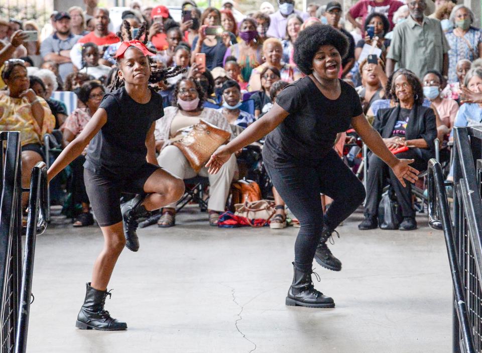 P'Asiah Sanders, 10, left, and Joyce Pond, 11, of Anderson, performs before the crowd with the I AM Strong Dance Company, an Interpretive Dance group, during the Anderson Area Remembrance and Reconciliation Initiative's Juneteenth event at Carolina Wren Park in downtown Anderson Saturday, June 19, 2021. 