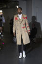 Wayne Ellington wears a Burberry Horseferry print trench coat Saint Laurent Classic Court sneakers before Game 1 of Pistons, Bucks on April 14.