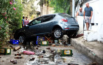 <p>A car, damaged on the overnight earthquake is seen in Bodrum, Turkey, Friday, July 21, 2017. (Photo: DHA-Depo Photos via AP) </p>