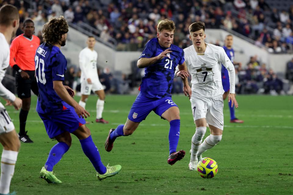 Jan 25, 2023; Los Angeles, California, USA; Serbia midfielder Luka Ilic (7) and USA midfielder Aidan Morris (21) fight for the ball during the second half at BMO Stadium. Mandatory Credit: Kiyoshi Mio-USA TODAY Sports