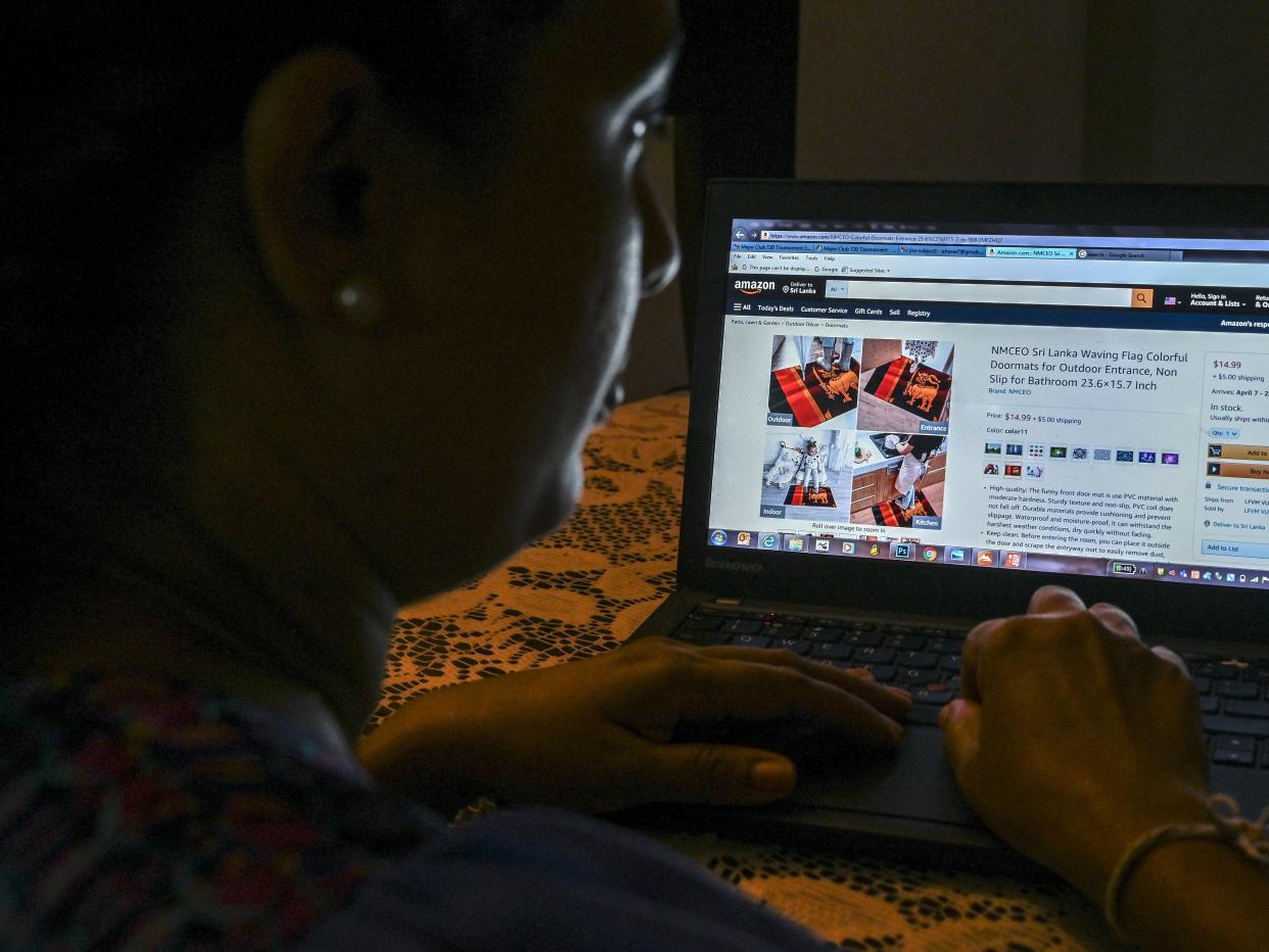 Woman looks through an Amazon webpage