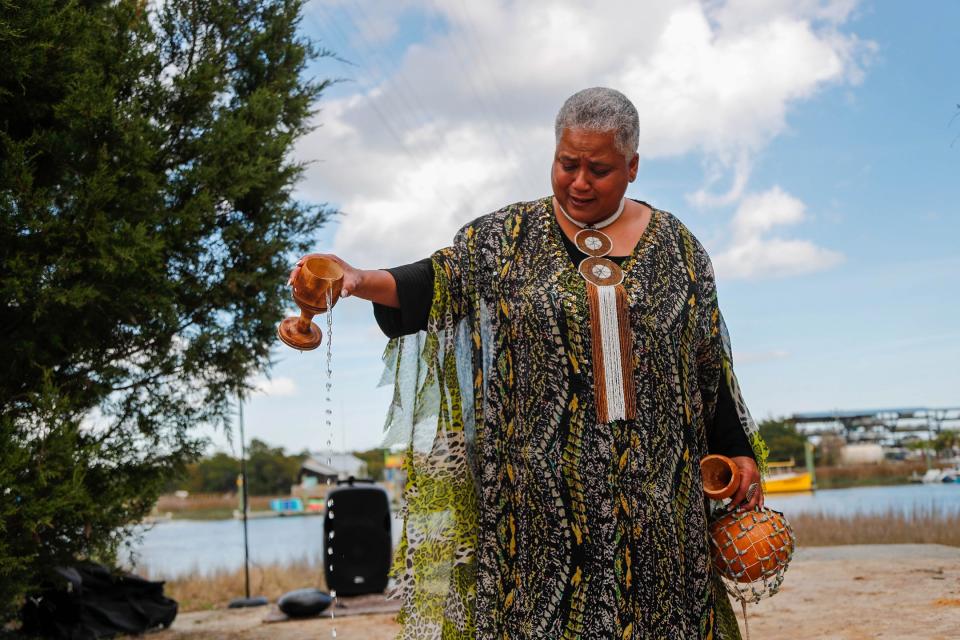 Lillian Grant-Baptiste performs a libation ceremony near the Lazaretto Creek Boat Ramp, honoring the ancestors and those that came before, for the first day of the 34th annual Savannah Black Heritage Festival on Wednesday February 1, 2023.
