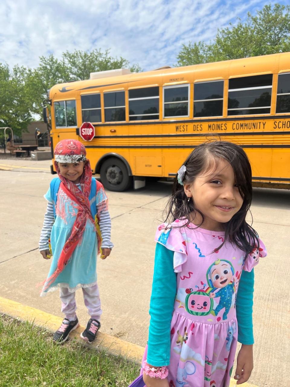 Busbibi Safi, 6, and her younger sister, Zinab Safi, 4, pose for a photo.