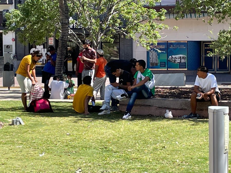 Venezuelan migrants rest in the shade at San Jacinto Plaza in Downtown El Paso after being released by federal officials. (Miguel Paredes/KTSM)