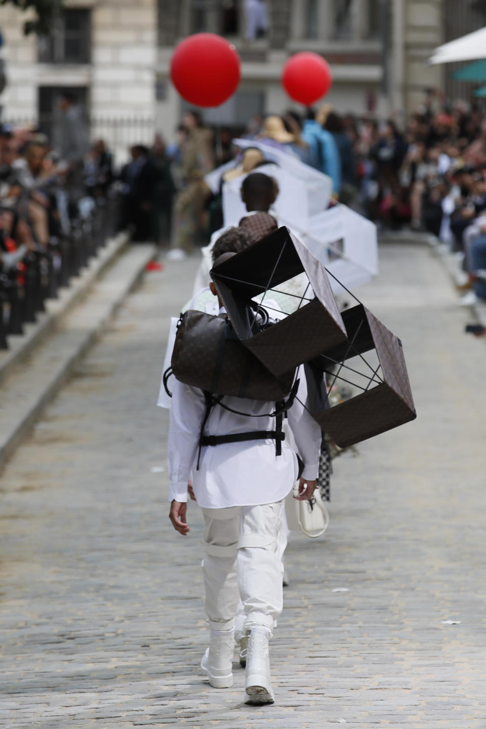 A model wears a creation for the Vuitton mens Spring-Summer 2020 fashion collection presented in Paris, Thursday, June 20, 2019. (AP Photo/Francois Mori)