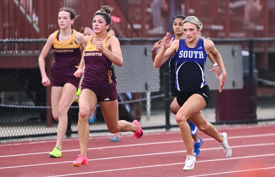 Bloomington North’s Grace Wellman and Bloomington South’s Eden Bailey compete in the 100 meter dash during the track meet at North on Wednesday, May 1, 2024.