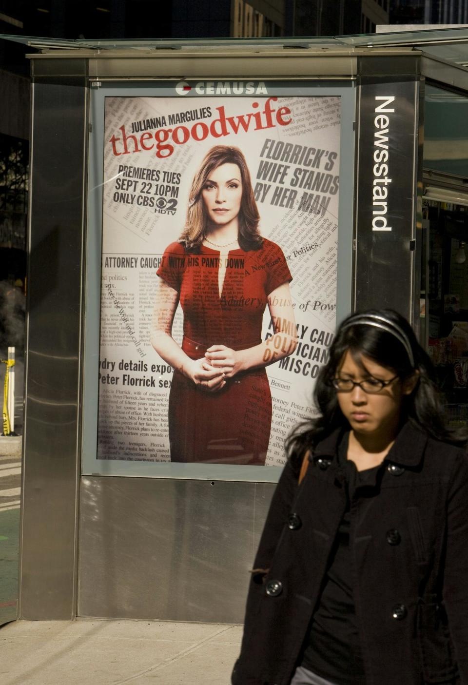 A woman walks past a billboard promoting CBS’s ‘The Good Wife’ in 2009, shortly after the show’s release. <a href="https://www.gettyimages.com/detail/news-photo/woman-walks-past-a-billboard-promoting-cbss-the-good-wife-news-photo/93117421?adppopup=true" rel="nofollow noopener" target="_blank" data-ylk="slk:George Rose/Getty Images;elm:context_link;itc:0;sec:content-canvas" class="link ">George Rose/Getty Images</a>