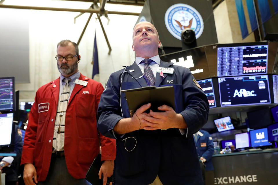 Traders pause for a moment of silence in honor of Veterans Day on the floor at the New York Stock Exchange (NYSE) in New York, U.S., November 11, 2019. REUTERS/Brendan McDermid