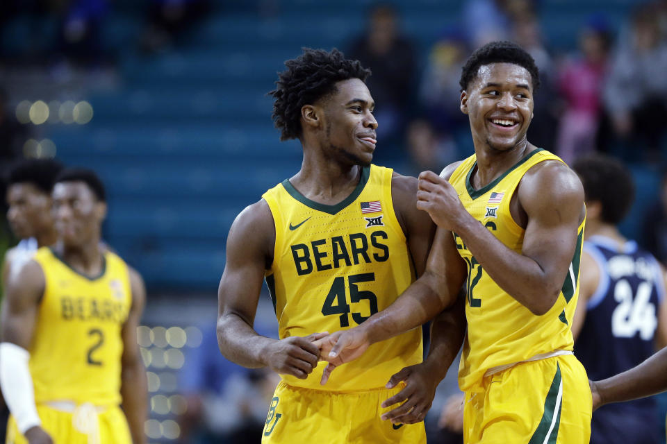 FILE - In this Sunday, Nov. 24, 2019 file photo, Baylor guard Davion Mitchell (45) and guard Jared Butler (12) react late in the second half of an NCAA college basketball championship game against Villanova at the Myrtle Beach Invitational in Conway, S.C. There really are no tougher matchups for Baylor guards Jared Butler, Davion Mitchell and MaCio Teague than in those countless hours they spend in the gym going 1-on-1 against each other. Or for opposing teams when that trio of guards is on the court together for the Bears, the Big 12 champions and a No. 1 seed in the NCAA Tournament for the first time. (AP Photo/Gerry Broome, File)