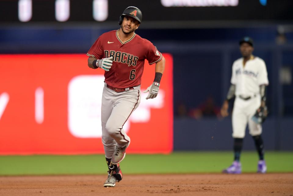 Arizona Diamondbacks left fielder David Peralta (6) rounds the bases after hitting a two-run home run against the Miami Marlins during the first inning of a baseball game, Monday, May 2, 2022, in Miami. (AP Photo/Jim Rassol)