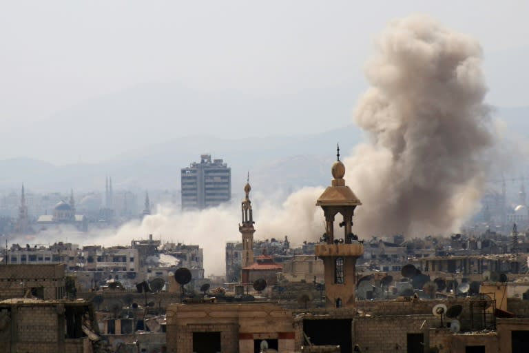 Smoke billows following a reported air strike in rebel-held parts of Jobar on the eastern outskirts of Damascus, on March 19