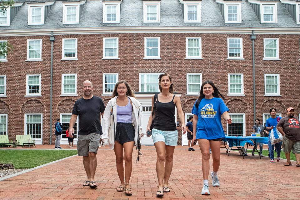 From left, the Ormsby family, 5th and 6th generation University of Delaware students, dad John ('95), Jordan ('24), mom Dorothea ('94) and Olivia ('27), support Olivia, a first-year student, as she moves in to on-campus housing at the University of Delaware's South Academy Hall in Newark, Friday, Aug. 25, 2023.