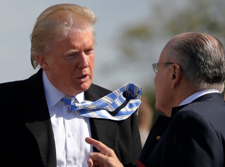 Trump speaks with Giuliani during a visit to a Civil War memorial in Gettysburg, Pa., Oct. 22, 2016. (Jonathan Ernst/Reuters)