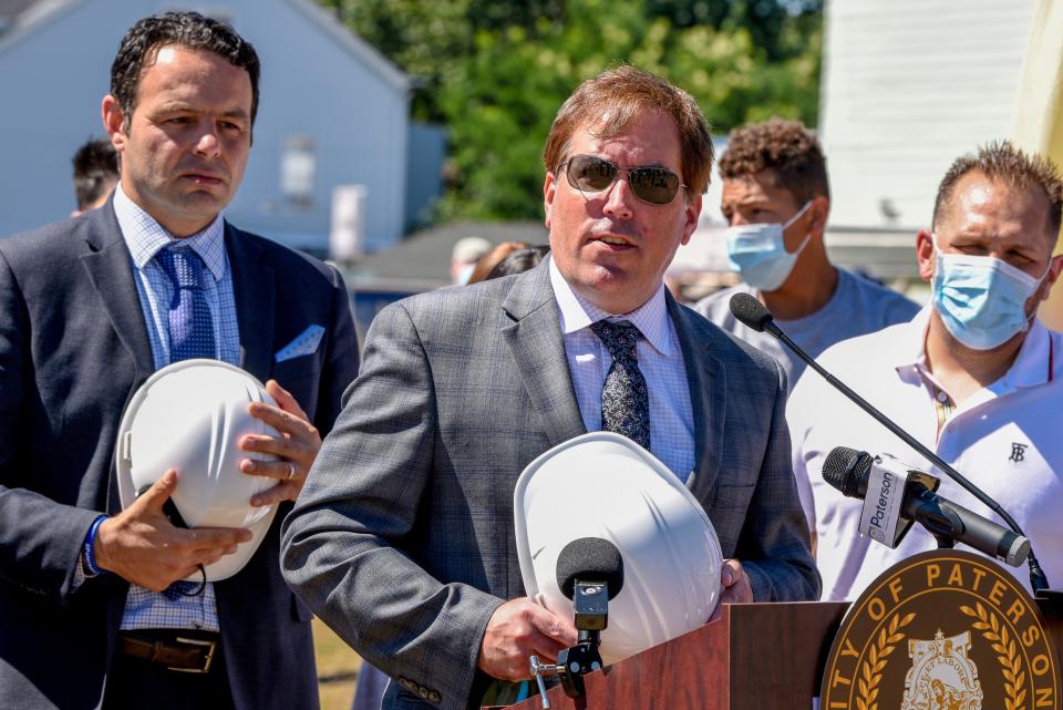 A fire destroyed the Paterson armory in 2015. Paterson officials gather at the site of the armory on Thursday August 20, 2020 to break ground on a new project led by developer Charles Florio to transform the lot into 138 apartments, commercial space as well as a police substation. Director of Economic Development Michael Powell speaks. 