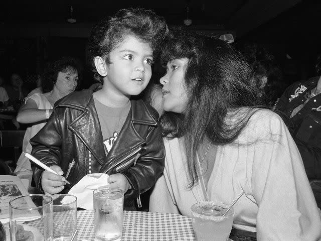 <p>Catherine McGann/Getty</p> Bruno Mars as a four year old Elvis impersonator, with his mother in August 1990 in Memphis, TN.
