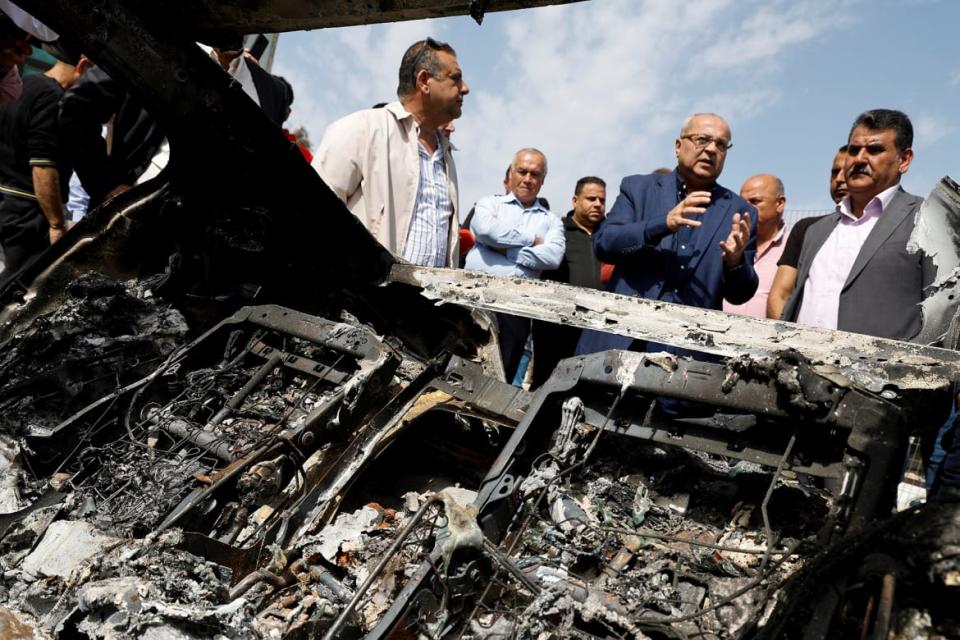 <div class="inline-image__caption"><p>Arab politician Ahmad Tibi visits Palestinian families after an Israeli settlers' rampage in Huwara, the Israeli-occupied West Bank, March 5, 2023.</p></div> <div class="inline-image__credit">Raneen Sawafta/Reuters</div>