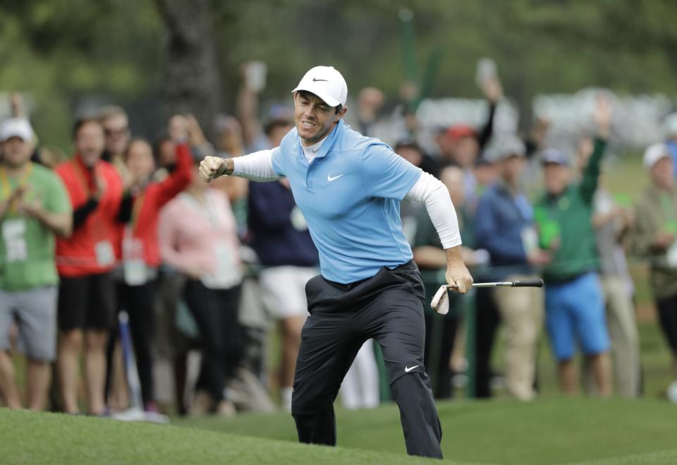 Rory McIlroy gets the crowd pumped up after draining an eagle on the eighth hole during the third round at the Masters. (AP Photo)