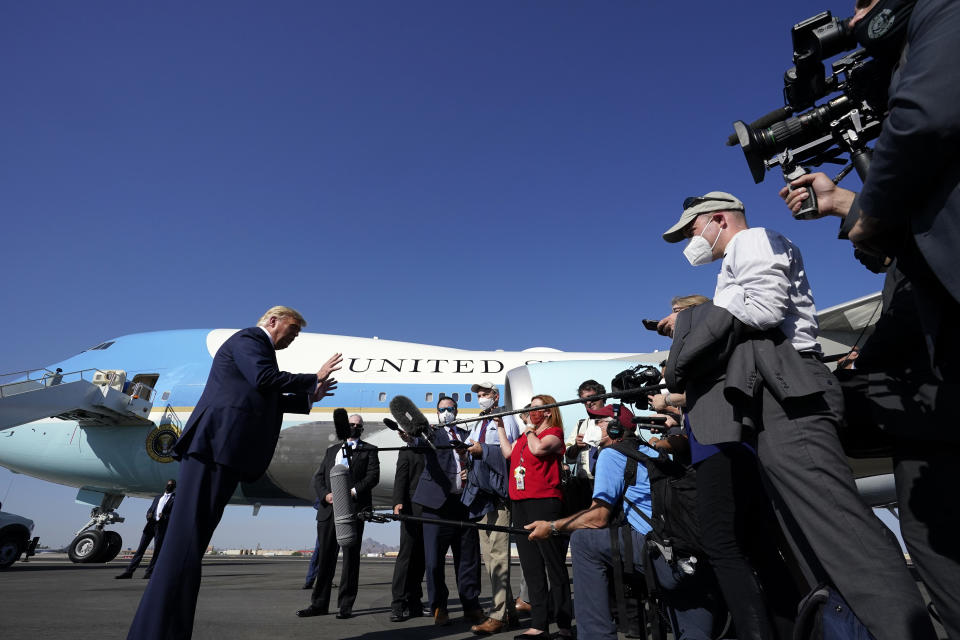 President Donald Trump speaks to reporters at Phoenix Sky Harbor International Airport, Monday, Oct. 19, 2020, in Phoenix. (AP Photo/Alex Brandon)