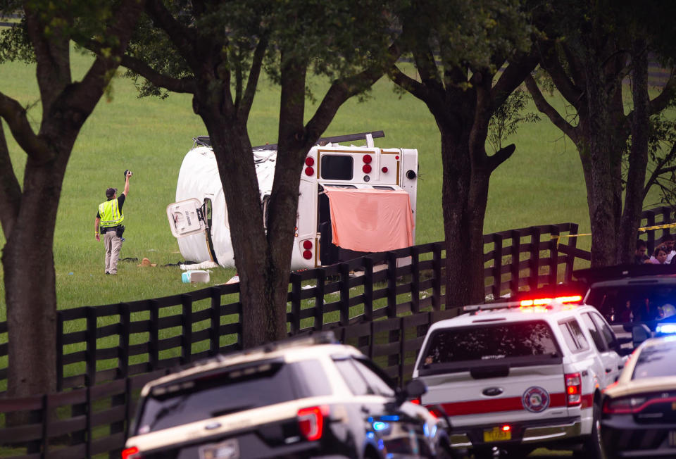 Emergency workers at the scene of a fatal bus crash (Doug Engle / Ocala Star-Banner / USA Today Network)