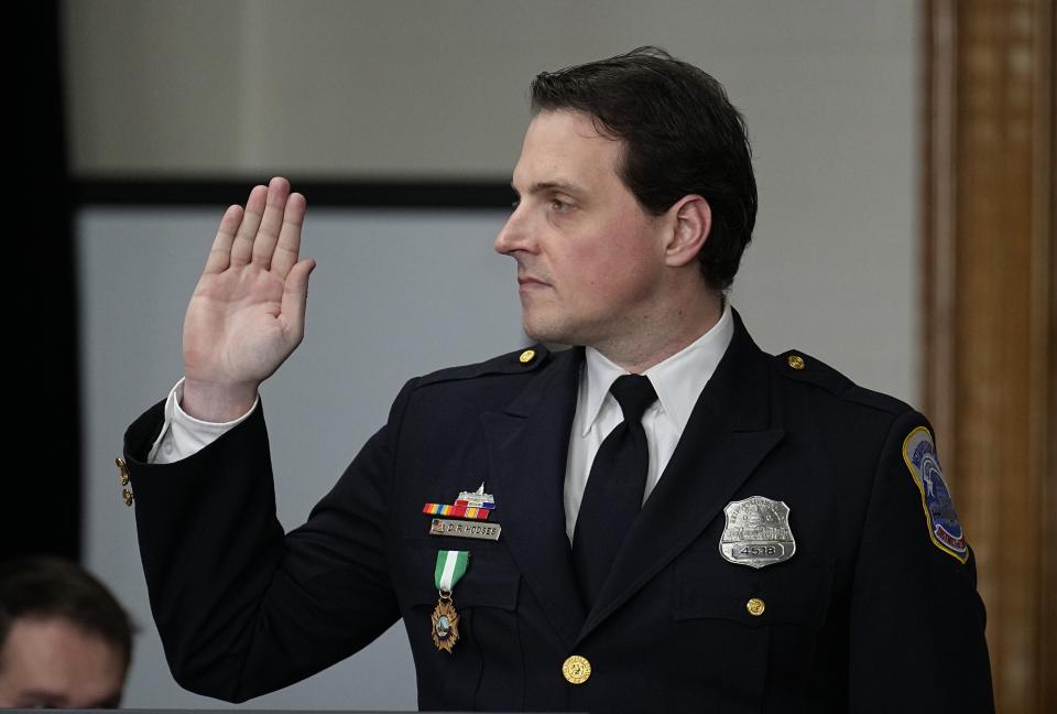 Washington DC Police Department officer Daniel Hodges is sworn in before testifying during a lawsuit to keep former President Donald Trump off the state ballot, in court Monday, Oct. 30, 2023, in Denver. (AP Photo/Jack Dempsey)