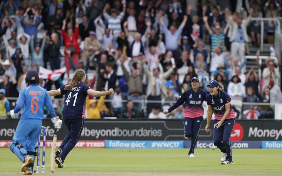 England's Natalie Sciver (R) celebrates after catching India's Deepti Sharma (L) during the ICC Women's World Cup cricket final between England and India at Lord's - Credit: AFP/Getty