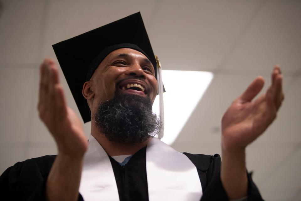 Marcus Boatwright applauds during a graduation ceremony from an addiction program at Trousdale Turner Correctional Center in Trousdale County, Tenn., Friday, May 10, 2024.