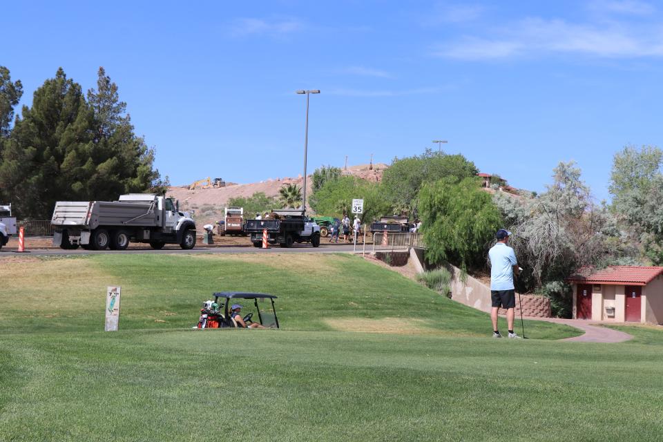 Volunteer crews work to tear-up non-functional grass on Sunbrook Drive as part of a "flip blitz" event, where 100,000 sq/ft of grass in Washington County is removed. May 19, 2022.