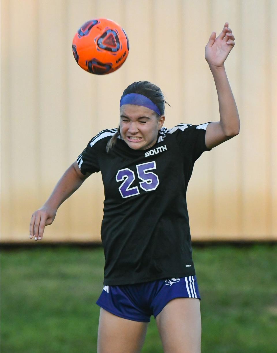 Bloomington South’s Izzy Sweet (25) heads the ball during the girls’ soccer match against Terre Haute North at South on Wednesday, August 30, 2023.