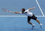 Ernests Gulbis of Latvia hits a return to Sam Querrey of the United States during their men's singles match at the Australian Open 2014 tennis tournament in Melbourne January 15, 2014. REUTERS/Brandon Malone