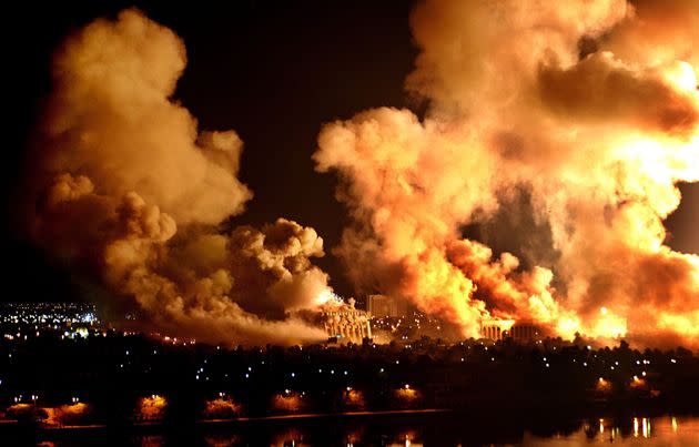 Fires rage on the west bank of the Tigris River on March 21, 2003, in Baghdad during the U.S. 