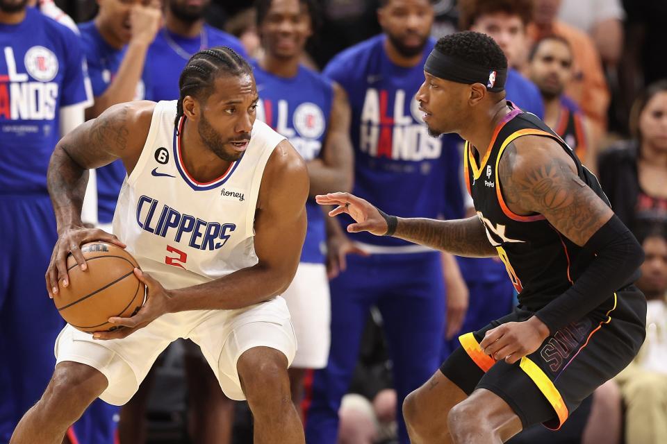 Los Angeles Clippers forward Kawhi Leonard handles the ball against the Phoenix Suns' Torrey Craig during Game 1 of their first-round series.