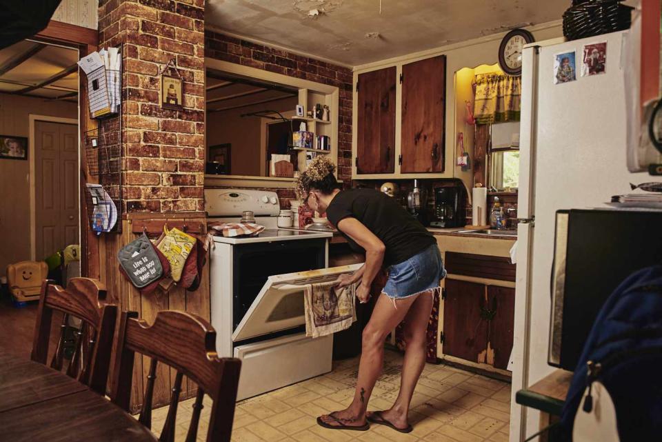 Tommie S. in her kitchen as she bakes THC-infused treats.