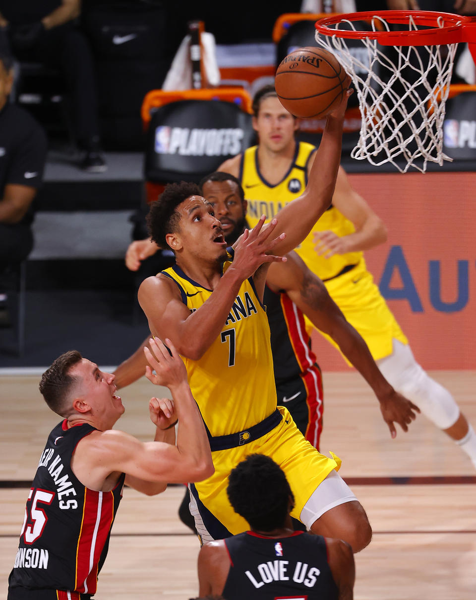 Malcolm Brogdon of the Indiana Pacers drives the ball to the basket during the second half against the Miami Heat in Game 1 of an NBA basketball first-round playoff series, Tuesday, Aug. 18, 2020, in Lake Buena Vista, Fla. (Mike Ehrmann/Pool Photo via AP)