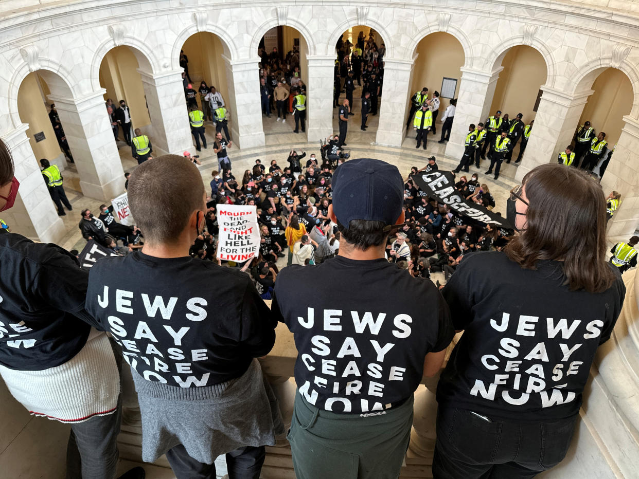 Protesters calling for a cease fire in Gaza and an end to the Israel-Hamas conflict look down on fellow protestors occupying the rotunda of the Cannon House office building, surrounded by a ring of U.S. Capitol police, on Capitol Hill in Washington, U.S., October 18, 2023. (Jonathan Ernst/Reuters)