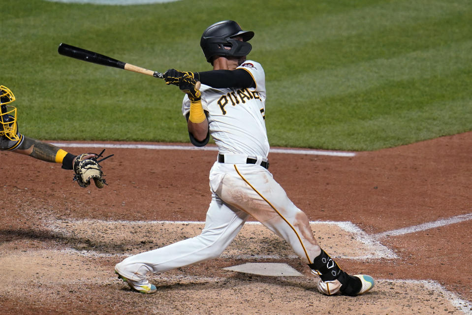 Pittsburgh Pirates' Michael Perez follows through on a solo home run off Milwaukee Brewers relief pitcher Jandel Gustave during the eighth inning of a baseball game in Pittsburgh, Thursday, June 30, 2022. It was the third home run of the game for Perez. (AP Photo/Gene J. Puskar)