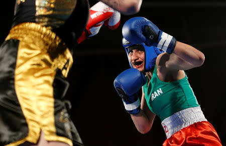 Iranian boxer Sadaf Khadem in action against French boxer Anne Chauvin during an official boxing bout in Royan, France, April 13, 2019. REUTERS/Stephane Mahe