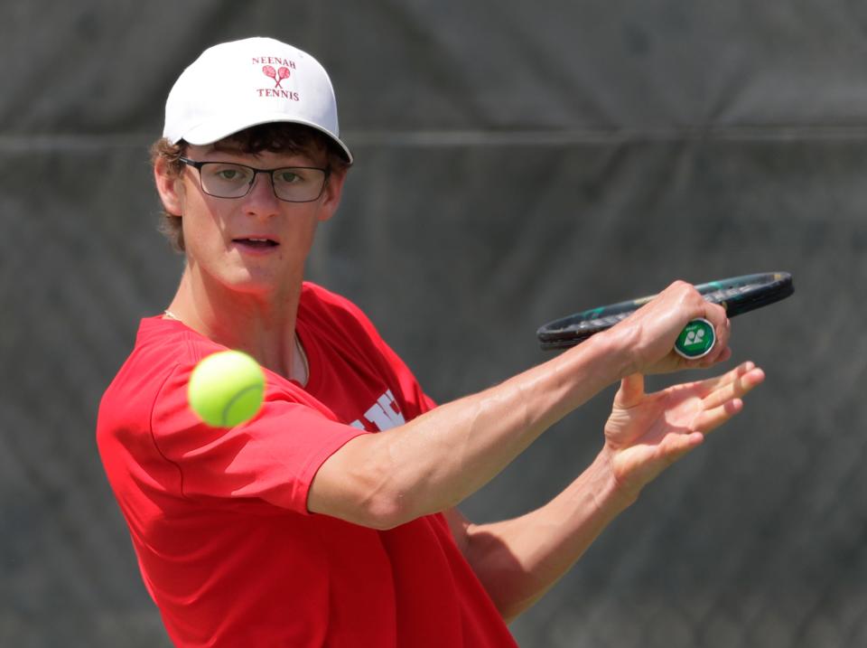 Neenah's Solomon Dunsirn competes during the Fox Valley Association boys tennis meet May 19. He is the No. 2 seed in Division 1 singles for the state meet.