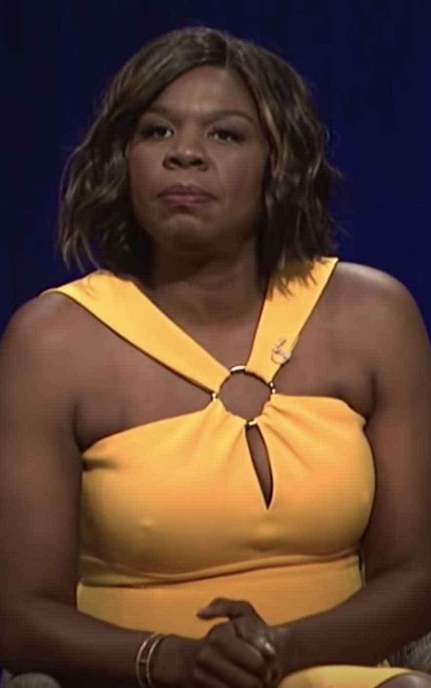 Jones wearing a bright dress in a film panel sketch