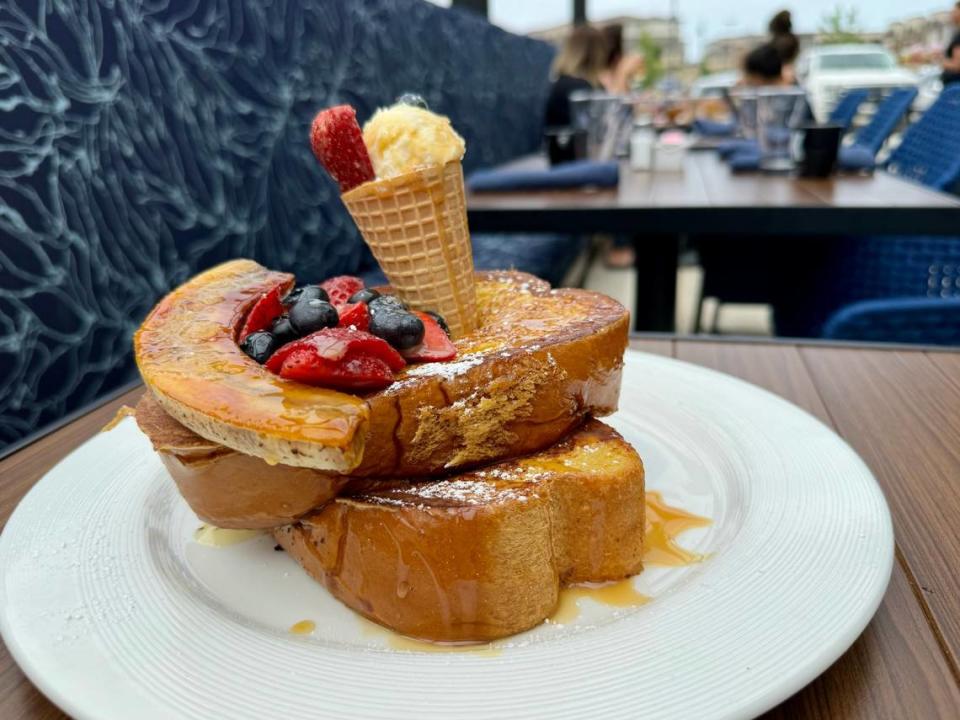 The “banana split” French toast at Hash Kitchen, shown on the patio May 11, 2024.