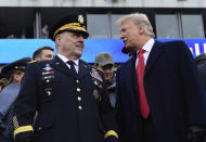 President Donald Trump, right, talks with Army Chief of Staff Gen. Mark Milley, left, during the Army-Navy NCAA college football game in Philadelphia, Saturday, Dec. 8, 2018. Trump announced that Milley will be the next chairman of the Joint Chiefs of Staff. (AP Photo/Susan Walsh)