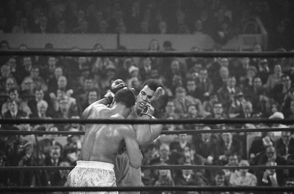 FILE - In this March 8, 1971 file photo, Joe Frazier, left, faces off against Muhammad Ali, right, on the ropes during the fourth round of their heavyweight title bout in New York. It wasn’t just a fight, but a political and sociological event. Ali was loved by many but despised by many more for his mouth, his refusal to be inducted in the Army and his Muslim religion. Frazier was his foil, a working man’s heavyweight labeled an ``Uncle Tom’’ by Ali because a lot of white Americans were cheering for him to win. (AP Photo/File)