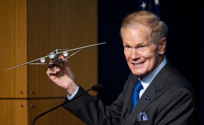NASA Administrator Bill Nelson with a model of Boeing’s Transonic Truss-Braced Wing aircraft. 