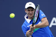 Hubert Hurkacz of Poland returns to Stefanos Tsitsipas of Greece during the quarterfinals of the Miami Open tennis tournament, Thursday, April 1, 2021, in Miami Gardens, Fla. Hurkacz won 2-6, 6-3, 6-4. (AP Photo/Lynne Sladky)